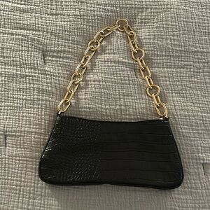 A new Day black snake skin chain purse